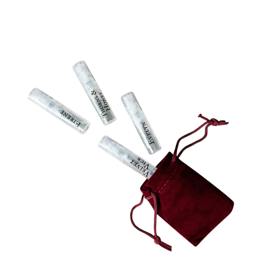 Set of small cylindrical containers with a red drawstring bag on a white background