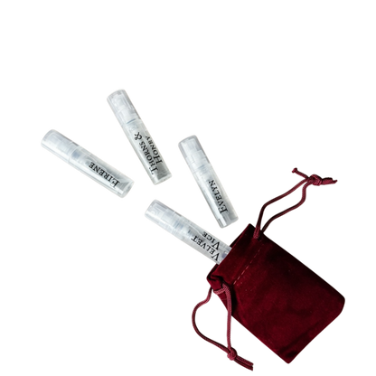 Set of small cylindrical containers with a red drawstring bag on a white background