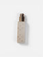 White spray bottle with silver nozzle on a white background