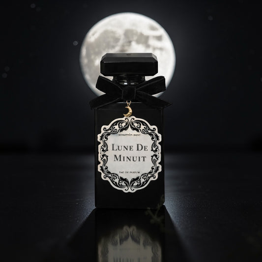 Perfume bottle labeled 'Lune de Minuit' with a full moon in the background