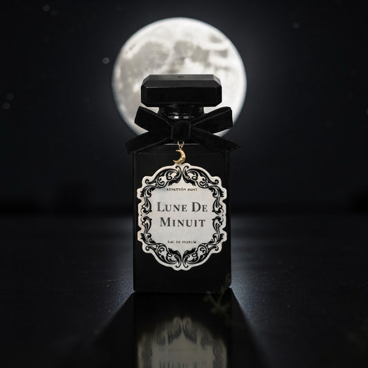 Perfume bottle labeled 'Lune de Minuit' with a full moon in the background