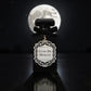 Perfume bottle labeled 'Lune de Minuit' with a full moon in the background